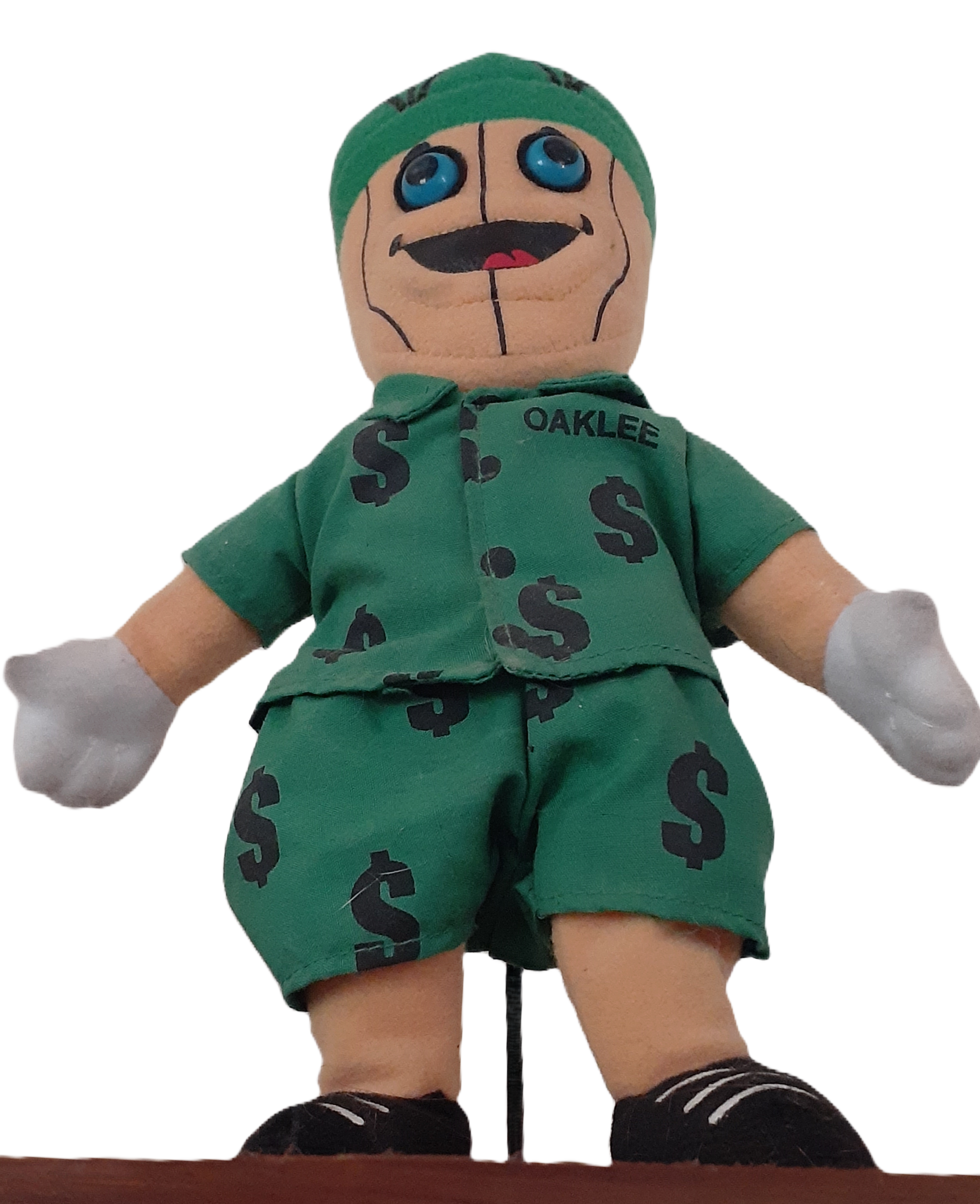 Acorn humanoid doll in green suit with dollar signs